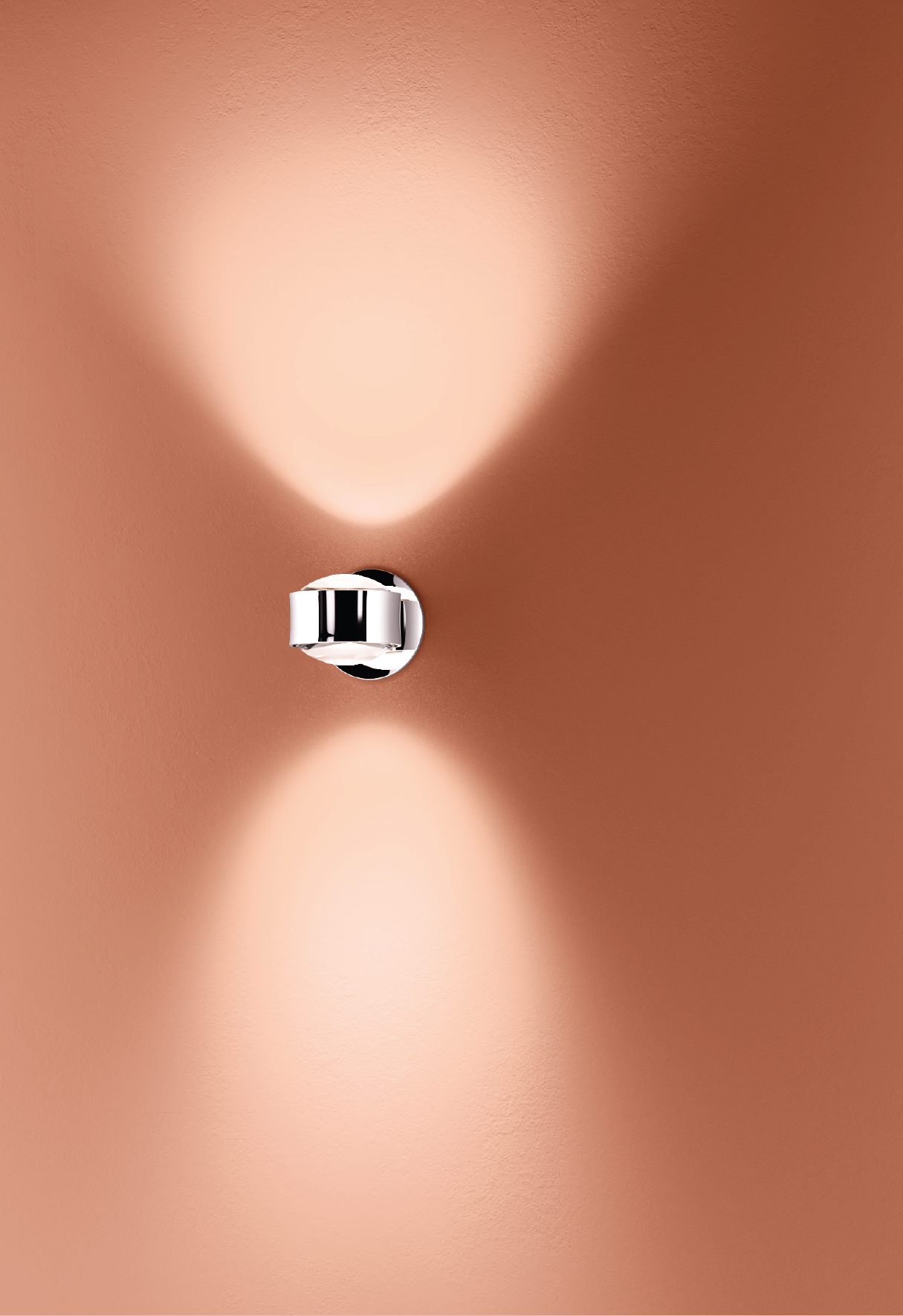 Lens wall light creating symmetrical up and down lighting effect on architectural wall surface.