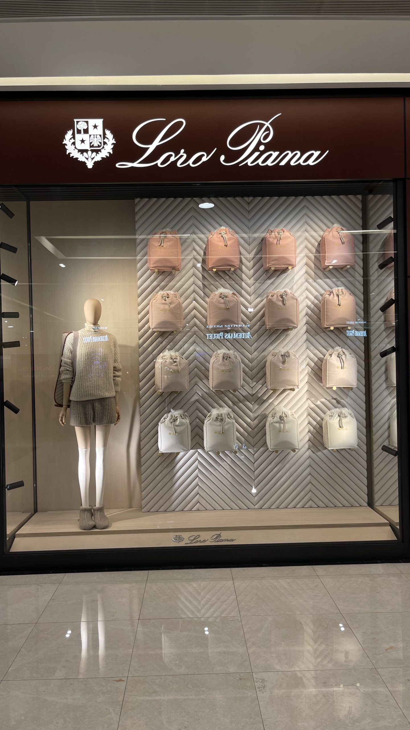 Loro Piana luxury retail window display lighting