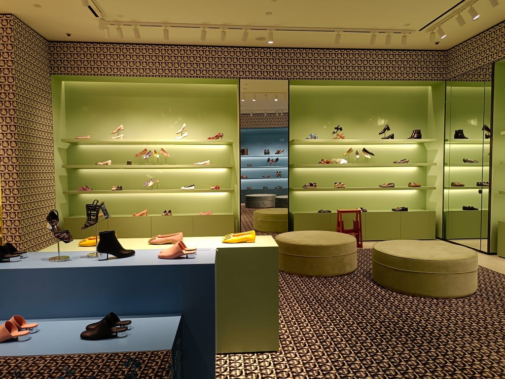 retail track lighting boutique display highlighting shoes and products