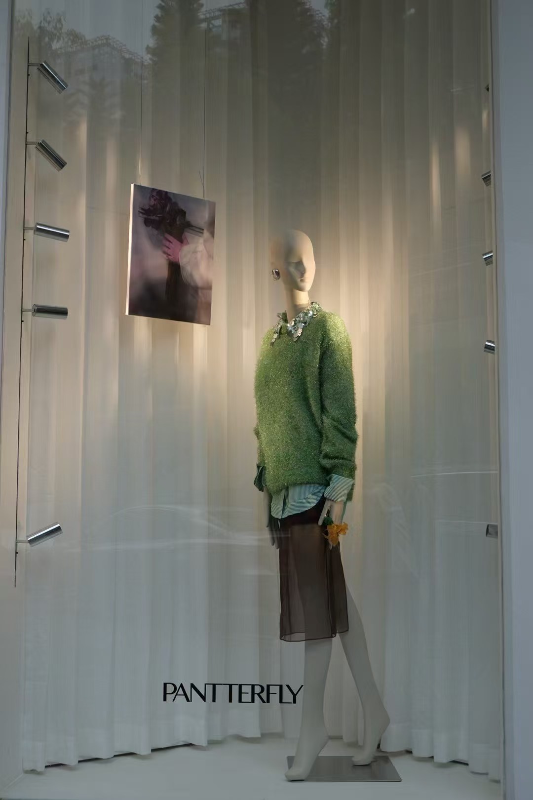 fashion boutique window display lighting with mannequin spotlight