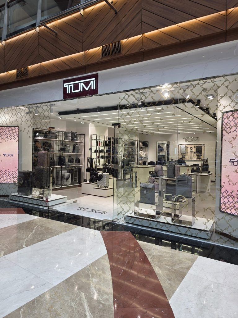 LED track lighting used for luggage display in luxury retail store