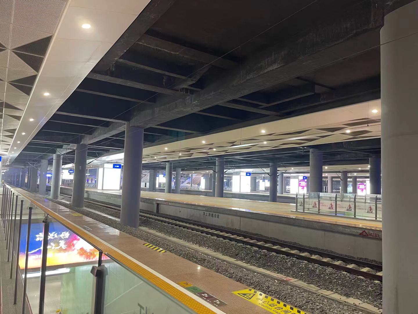 Yancheng Railway Station platform lighting with recessed LED downlights and architectural ceiling lighting.
