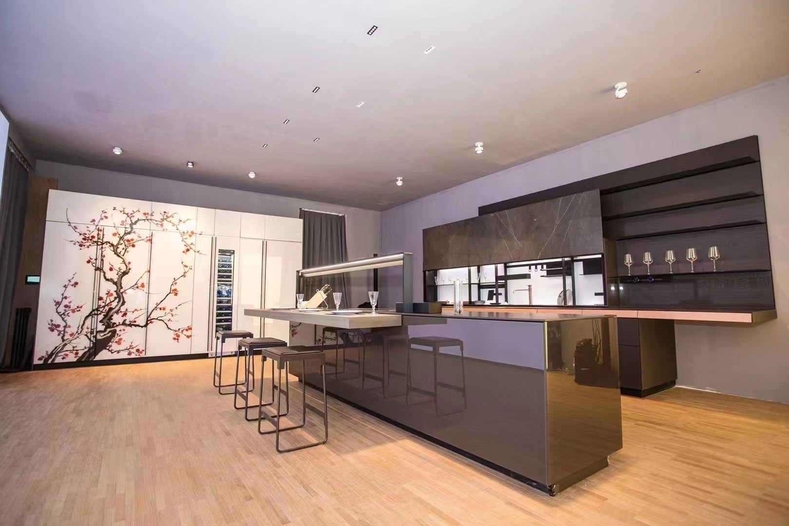 Modern residential kitchen interior illuminated with recessed LED downlights and architectural lighting design.