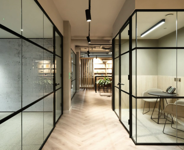 modern office corridor with LED track lighting and architectural commercial lighting design